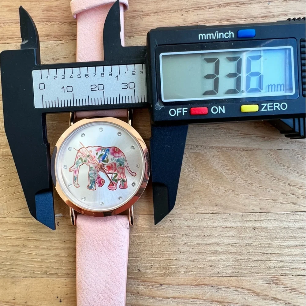 Unbranded ladies pink floral elephant rose gold tone watch NEW BATTERY